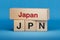 Japan and JPN symbol. Concept words Japan and JPN on wooden blocks.