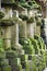 Japan Mara Row of stone lanterns in garden