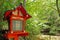 Japan red traditional outdoor lamp, zen garden, river, green plants