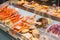 Japan seafood market shrimp seashell squid and Alaskan king crab legs sale in food store