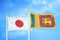 Japan and Sri Lanka two flags on flagpoles and blue cloudy sky