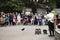 Japanese actor men playing doll puppet show people and foreign travelers in winter and autumn sakura at Ueno in Tokyo, Japan