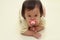 Japanese baby girl sucking on a pacifier