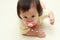 Japanese baby girl sucking on a pacifier