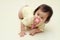 Japanese baby girl sucking on a pacifier