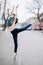 Japanese ballerina performs arabesque pose on street