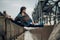 Japanese ballerina sitting in twine pose on the bridge