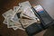 Japanese banknotes and coins scattered on the wooden table near the wallet.