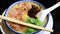 Japanese barbecued char siu pork ramen noodles in pork-bone broth and topped with scallions.