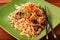 Japanese Beef Yakisoba entree in a green plate