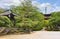 Japanese bell tower and buddhist three-story timber pagoda in gotokuji zen temple.