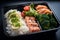 japanese bento lunch box with salmon rice and vegetables
