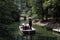 Japanese boatman rowing for tourist