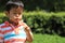 Japanese boy blowing dandelion seeds