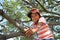 Japanese boy climbing the tree