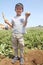 Japanese boy digging potato