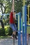 Japanese boy playing with climbing pole