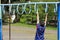 Japanese boy playing with a monkey bars