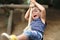 Japanese boy playing with tarzan rope