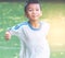 Japanese Boy running in soccer jersey with sunshine in the morning