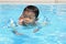 Japanese boy swiming in the pool