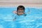 Japanese boy swiming in the pool