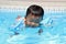 Japanese boy swiming in the pool