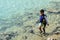 Japanese boy swimming with snorkel