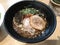 Japanese braised pork belly noodle served in black creamy Japanese pork bone broth.