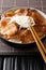 Japanese Butadon pork rice bowl close-up in a bowl. Vertical