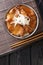 Japanese Butadon pork rice bowl close-up in a bowl. Vertical top view