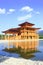 Japanese castle with shadow on water in Hinoki land