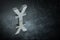 Japanese of Chinese Currency Symbol or Sign With Mirror Reflection on Dark Dusty Background