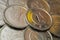 Japanese coins in 1 yen close-up. Surface or heap. Aluminum shines yellow. News about the economy and the central bank of Japan.