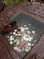 Japanese coins in little stone basin of a shrine.