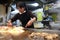 Japanese cook prepares the famous okonomiyaki for the guests in