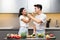 Japanese Couple Cooking Feeding Each Other Tasting Dinner In Kitchen