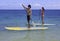 Japanese couple on paddle boards