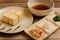 Japanese Crispy deep fried Tofu or Agedashi Tofu served with tentsuyu broth, bonito flakes, Grated radish and green onions .