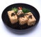 Japanese Crispy deep fried Tofu or Agedashi Tofu served in tentsuyu broth isolated on white background with clipping path