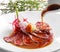 Japanese cuisine beef tataki poured with soy sauce