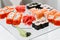 Japanese Cuisine -Buffet catering style Sushi Set in restaurant - salmon Maki Sushi and Nigiri Sushi. selective focus