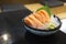 Japanese cuisine with copy space, Raw Salmon Sashimi with Wasabi on black bowl.