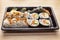 Japanese Cuisine: Tasty Uramaki , Futomaki and temaki served in the take-away box