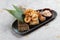 Japanese deep fried squid mixing tempura flour Squid Karaage served with sauce in black plate washi Japanese paper