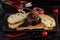 Japanese duck pate with warm ciabatta on dark wooden background