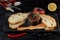 Japanese duck pate with warm ciabatta on dark wooden background