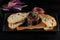 Japanese duck pate with warm ciabatta on dark wooden background