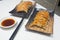 Japanese dumplings- called Gyoza or Jiaozi in China, Gyoza with pork meat and vegetables, close up Gyoza in black plate