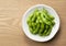 Japanese edamame in the background of wood grain